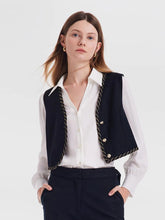 a woman in black gilet